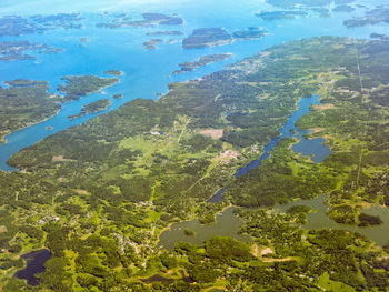 Aerial view of river and trees against sky