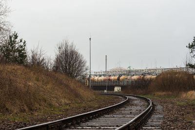 Railroad tracks against clear sky