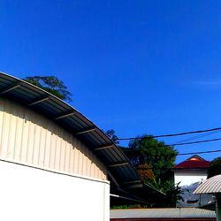 Low angle view of building against blue sky