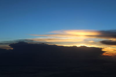 Scenic view of silhouette landscape against sky during sunset