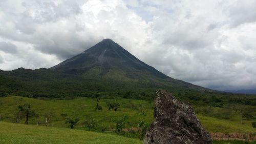 Scenic view of landscape against cloudy sky