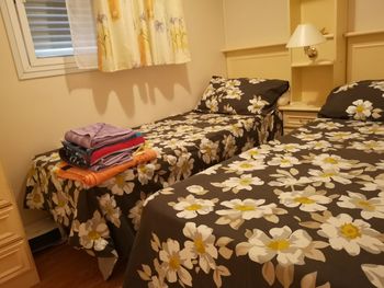 Various flowers on bed at home