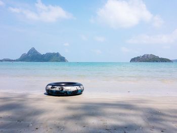 View of boat on beach against sky