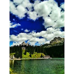 Scenic view of lake against cloudy sky