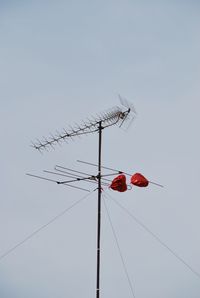Red heart shaped balloons attached to antenna