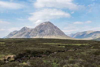 Sun illuminated stob dearg in contrast with surrounding ground, scottish highlands, uk
