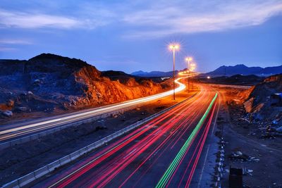 High angle view of light trails on road against sky