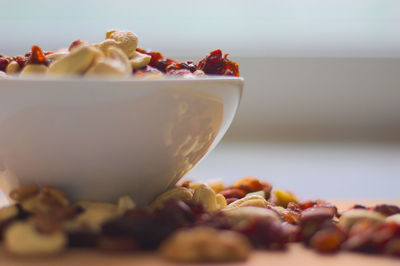 Close-up of bowl with nuts on table