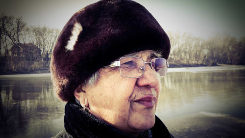 Close-up of woman against lake