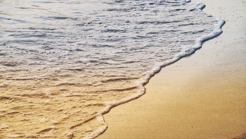 High angle view of surf on beach