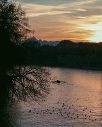 Scenic view of lake against sky during sunset