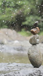 Close-up of stone stack on rock