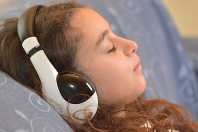 Close-up portrait of woman lying down