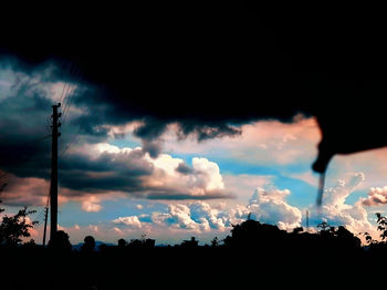 Low angle view of silhouette trees against sky during sunset