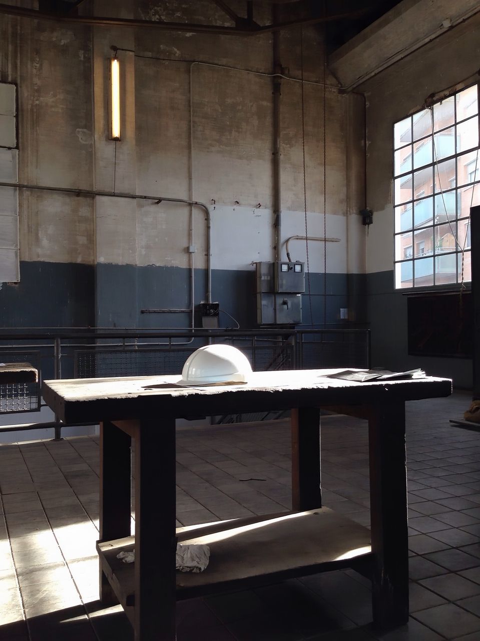 indoors, architecture, built structure, window, chair, empty, absence, interior, building exterior, day, no people, table, sunlight, building, glass - material, flooring, modern, abandoned, reflection, factory