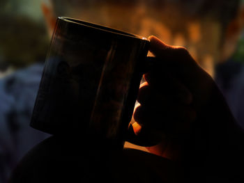 Close-up of hand holding drink