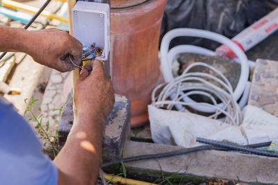 Close up of an electricians connects wires in the house.