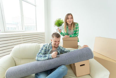 Young couple sitting at home