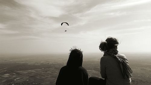 Silhouette of people against sky