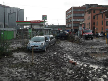 Cars on road against buildings in city