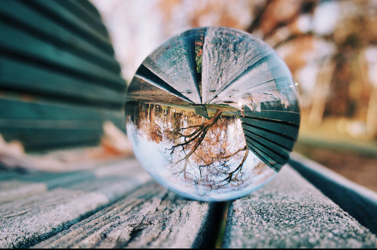 CLOSE-UP OF GLASS CONTAINER WITH REFLECTION