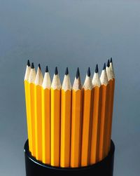 Close-up of colored pencils against white background