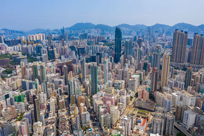 Aerial view of modern buildings in city against sky