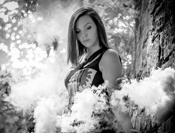 Portrait of woman with arms raised