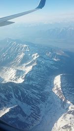 Aerial view of landscape seen through airplane window