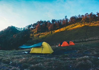 Tent on field against sky