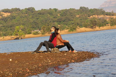 Young woman sitting on beach