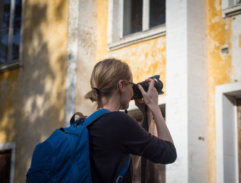 Woman photographing outdoors