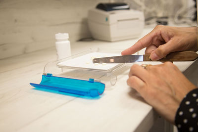 Close-up of man working on table