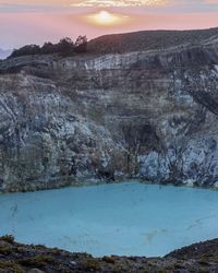 Scenic view of rocks against sky during sunset