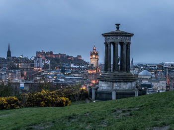 View of tower in city at night