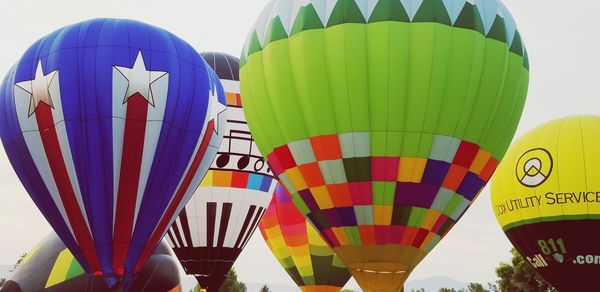 Low angle view of hot air balloons against sky