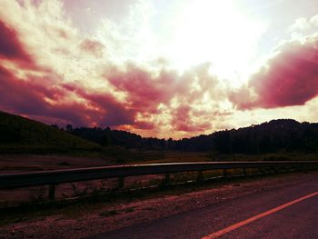 Scenic view of landscape against cloudy sky