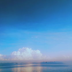 Scenic view of sea against blue sky