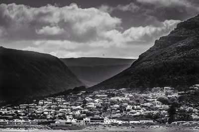 View of town against cloudy sky