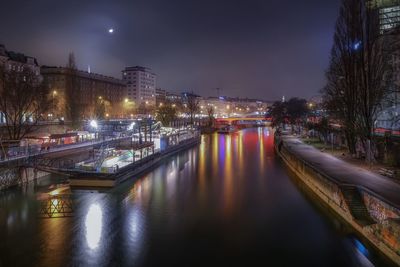 Danube river by illuminated city at night