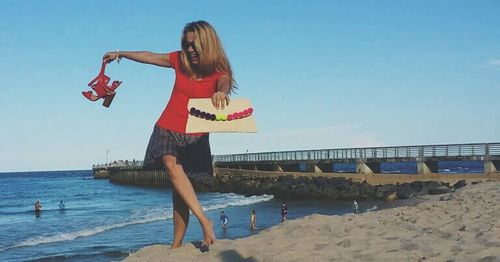 Woman standing on beach