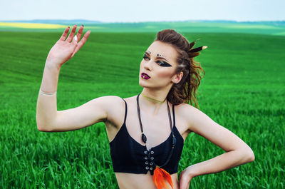Portrait of a young woman in a field