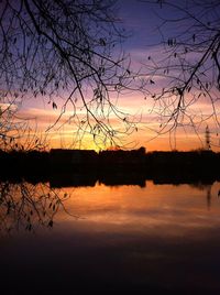 Scenic view of lake against orange sky