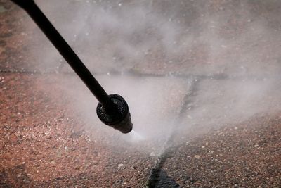 High angle view of high pressure cleaner on road