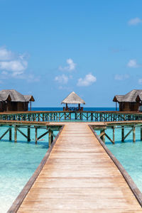 Pier over sea against sky