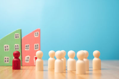 Close-up of toys on table against blue background