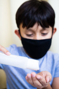 Close-up portrait of boy holding ice cream