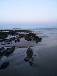 Scenic view of sea against clear sky