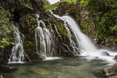 View of waterfall in forest