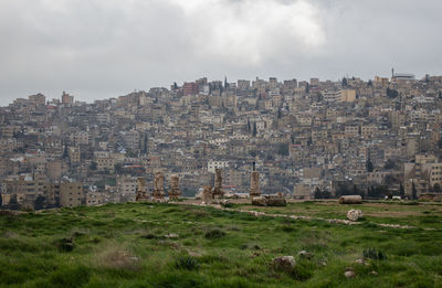 Buildings in city against sky